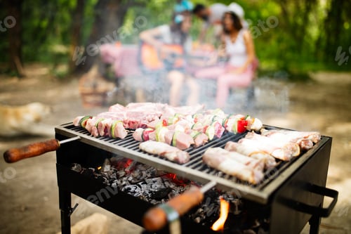 Preview: Grilled meat with vegetables over the coal on barbecue