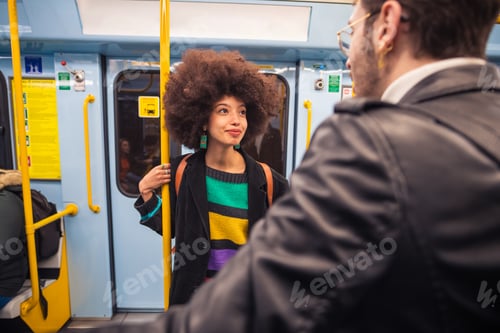 Preview: Multiethnic friends travelling underground chatting together having fun enjoying trip
