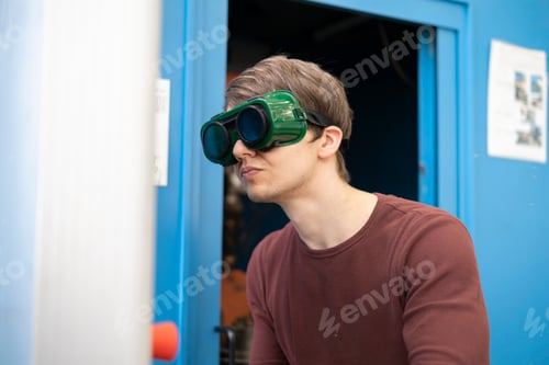 Preview: portrait of an industrial worker in protective welding glasses b