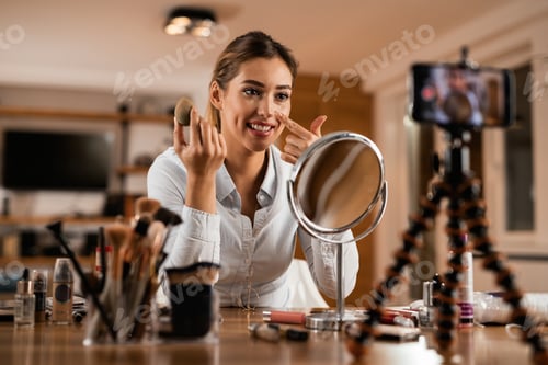Preview: Beautiful woman vlogging about applying make-up foundation.