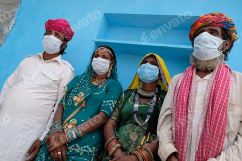 Preview: Group of Indian people in national costumes wearing face masks during the COVID-19 pandemic