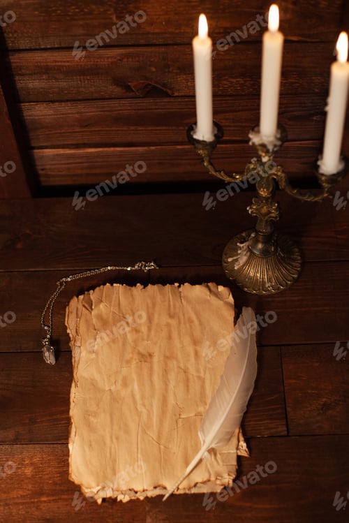 Preview: Halloween still life with burning candle on witch book and magic objects