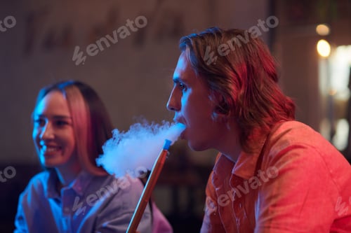Preview: Man Smoking Hookah with Friends