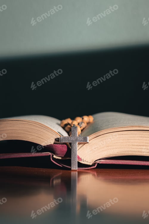 Preview: Cross on the holy bible on a wooden table