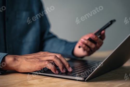 Preview: A man makes a hand gesture as a sign of work in a professional pose, posing for the camera while