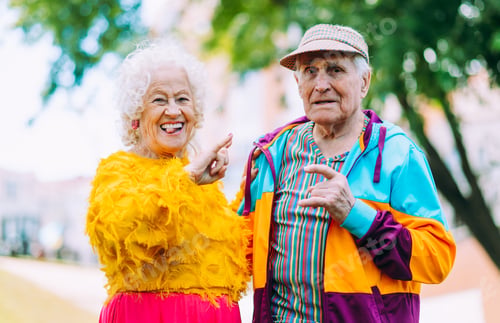 Preview: old modern couple dressing fashionable colored clothes