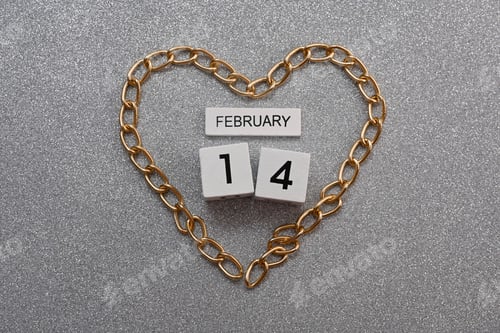 Preview: gold chain is laid out in the shape of a heart. February 14. Valentine's Day.