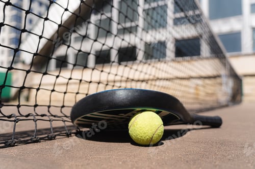 Preview: Padel ball under racket on court