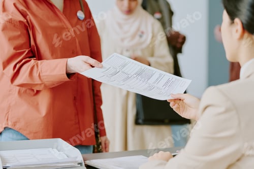 Preview: Unrecognizable Woman Taking Ballot Paper