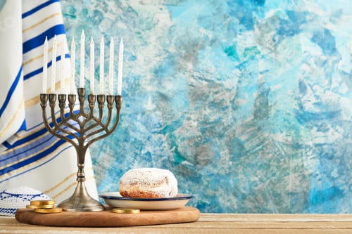 Preview: Happy Hanukkah. Hanukkah old Menorah against background of the Israeli flag with sunlight or bokeh o