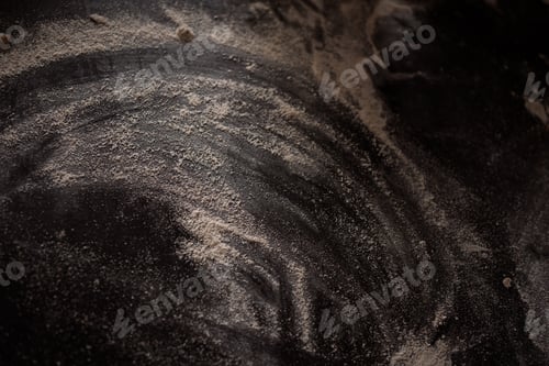 Preview: light flour on a dark table abstract picture