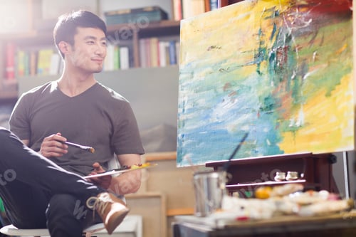 Preview: Artist painting in his studio