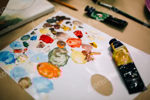 Preview: Multicolored palette in art studio, bright acrylic paints