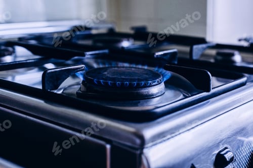 Preview: Kitchen gas hob, stove cook with blue flames burning