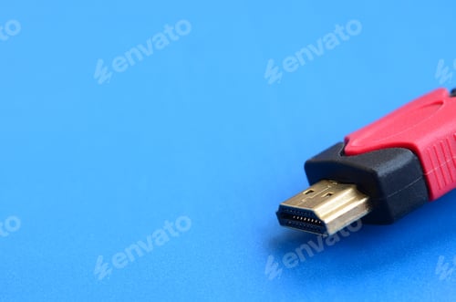 Preview: Black audio video HDMI computer cable on blue background