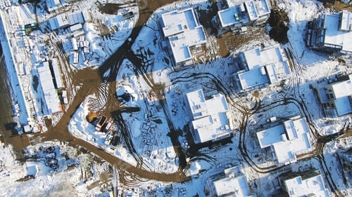 Preview: Aerial view of the winter cottages construction on the modern ski resort surrounded by forest