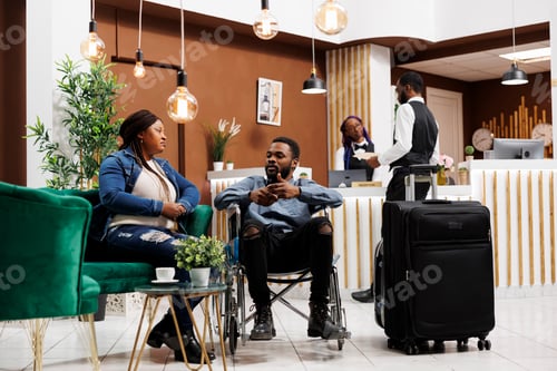 Preview: Tired woman and disabled man in hotel