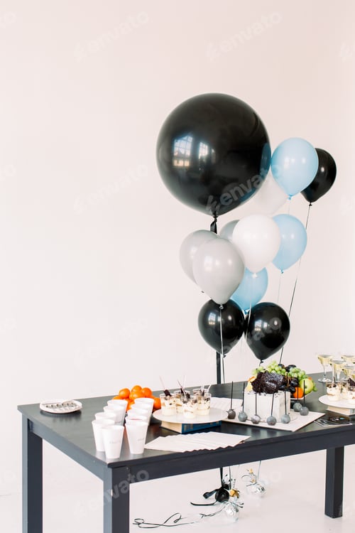 Preview: Delicious birthday reception. Birthday Cake, fruits and desserts on a background balloons party