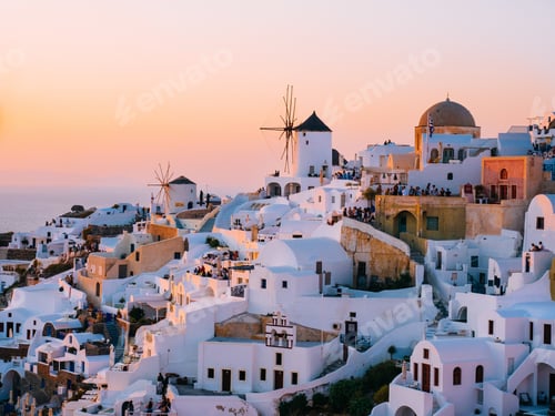 Preview: Oia traditional cave houses in Santorini, Greece at sunset