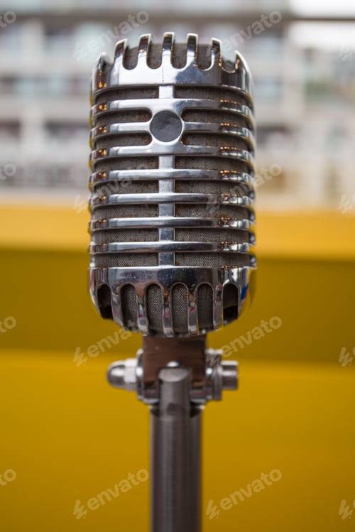 Preview: Vintage microphone on a yellow background
