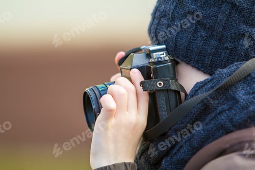 Preview: Portrait of little boy with vintage photo camera