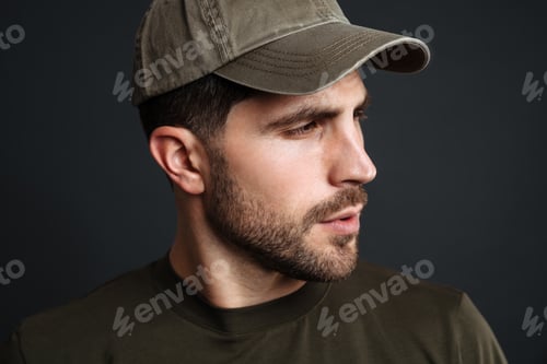 Preview: Focused masculine military man posing and looking aside