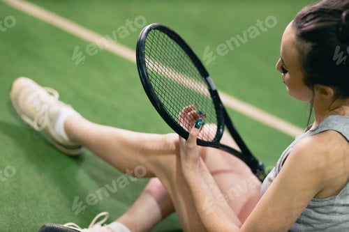 Preview: Tennis woman player portrait with racket and ball at court.
