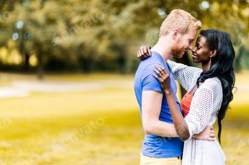 Preview: Couple in love hugging and kissing peacfully outdoors