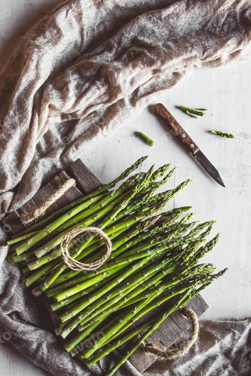 Preview: Green asparagus on an old wight table
