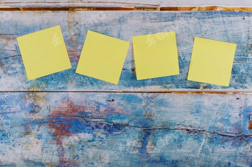 Preview: Four yellow sticker note in the blue old wooden background