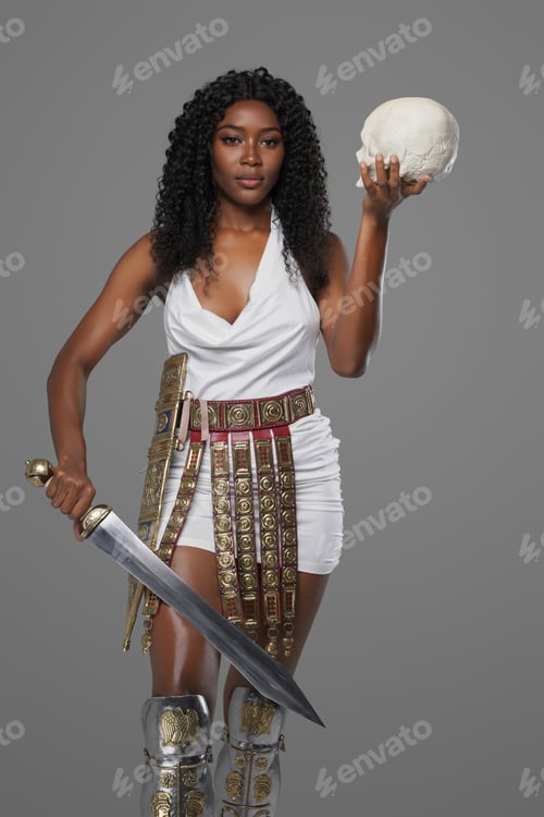 Preview: Dark-skinned model in white tunic an ornate belt holds gladius sword and skull