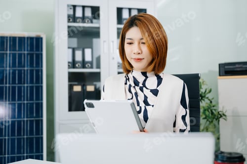 Preview: Woman freelancer is working her job on computer tablet and laptop