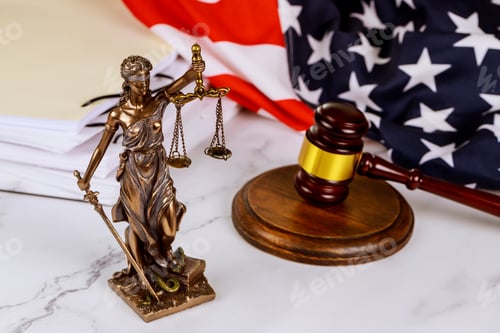 Preview: A statue of justice in front of a gavel with administration documents folders standing on a lawyer's