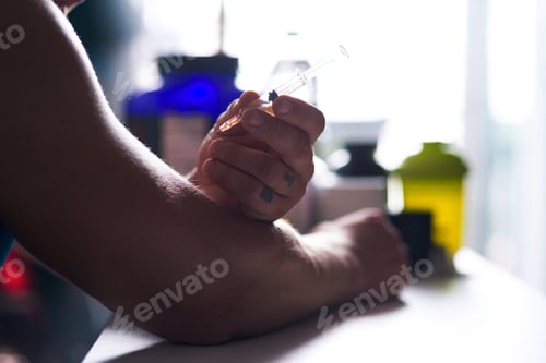 Preview: Strongman making an injection at the table