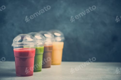 Preview: Colorful smoothie selection on dark slate background