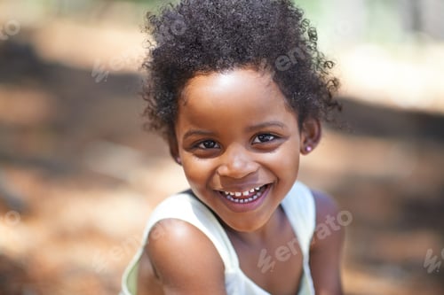 Preview: Portrait of an adorable little girl smiling at the camera while enjoying a day outdoors