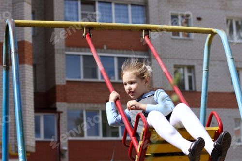 Preview: Girl riding on a swing. Schoolgirl walking after school. Active leisure for kids. Back to school.
