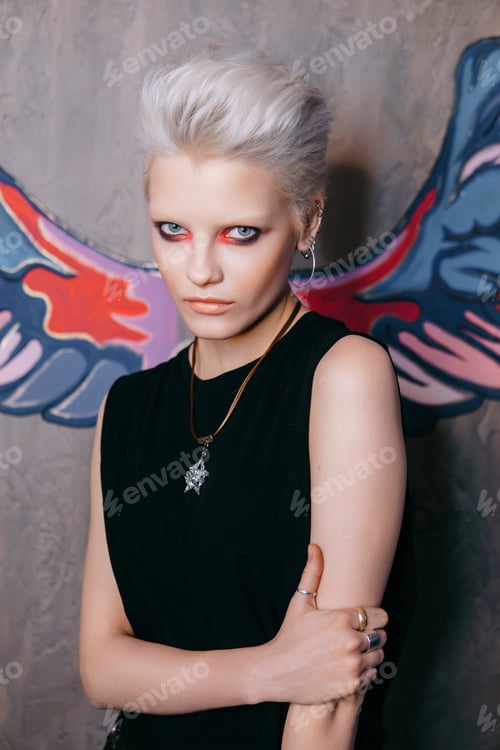 Preview: Portrait of a young fashionable blonde girl with an original hai
