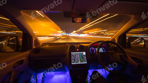 Preview: The man drive car in the city road. Left side traffic. Evening night time