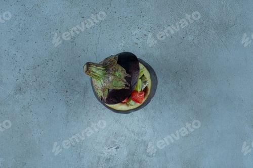 Preview: Vegetable salad inside a carved purple eggplant