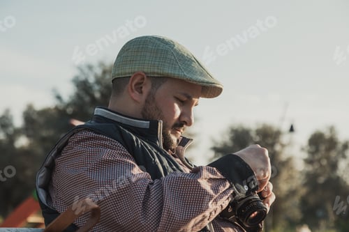 Preview: Photographer Checking The Film Inside The Vintage Camera