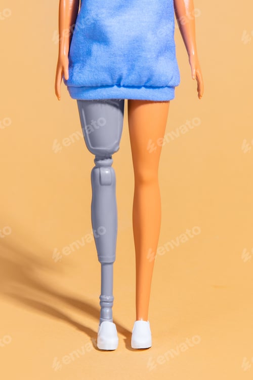 Preview: female doll with a prosthetic leg. Focus on low part of body