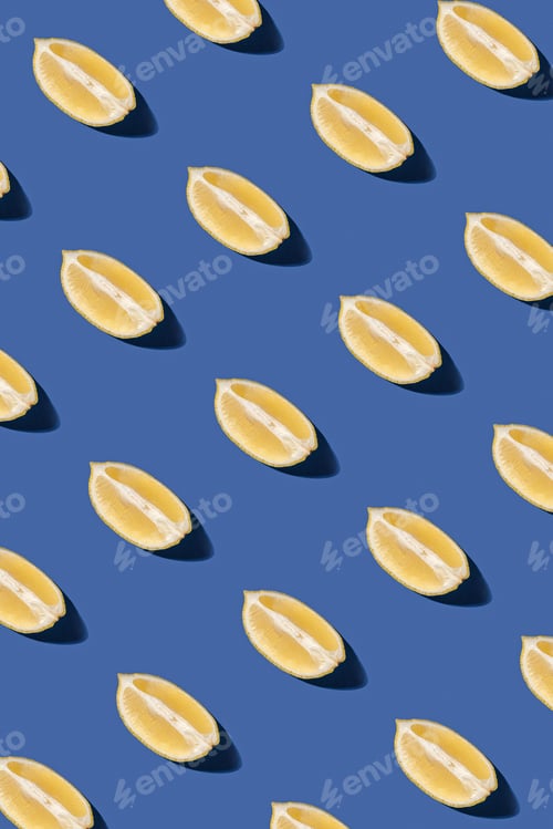 Preview: Lemon slices pattern on pastel blue background. Minimal sunlit flat lay.