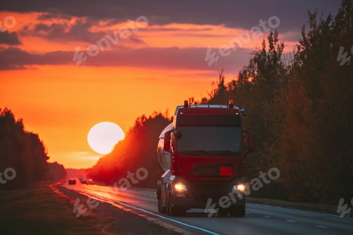 Preview: Red Truck Or Tractor Unit, Prime Mover, Traction Unit In Motion On Road, Freeway. Asphalt Motorway