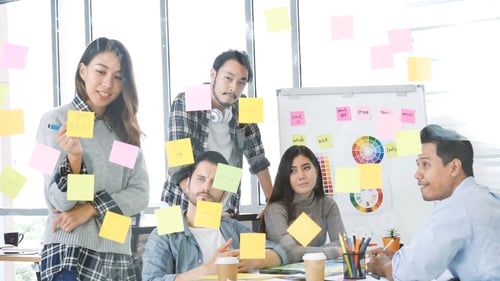Preview: Group of business people meeting in conference room brainstorming consult business document