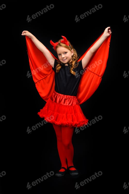 Preview: child in halloween costume of devil, isolated on black