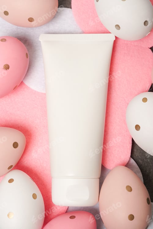 Preview: Cosmetics cream white tube on colorful Easter background with eggs