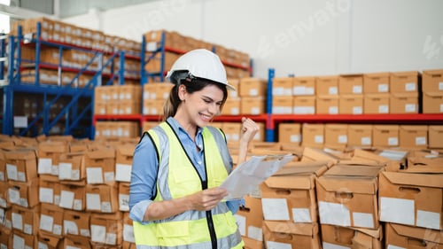Preview: A worker in the warehouse checking the stock is on the shelves at the manufacturing.
