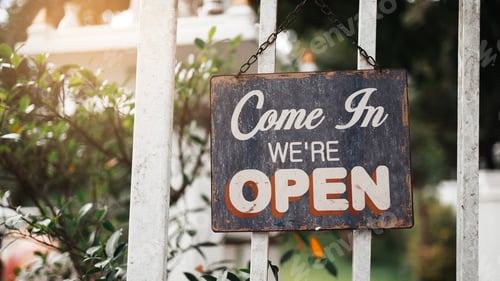 Preview: Open sign board through the door glass.