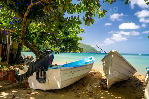 Preview: Boats on the andy beach under the cloudy blue sky